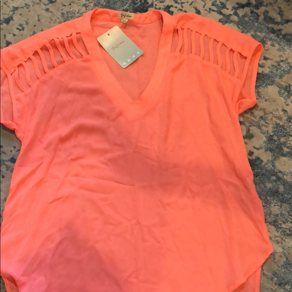 Neon pink/coral size S top with cutouts on sleeve